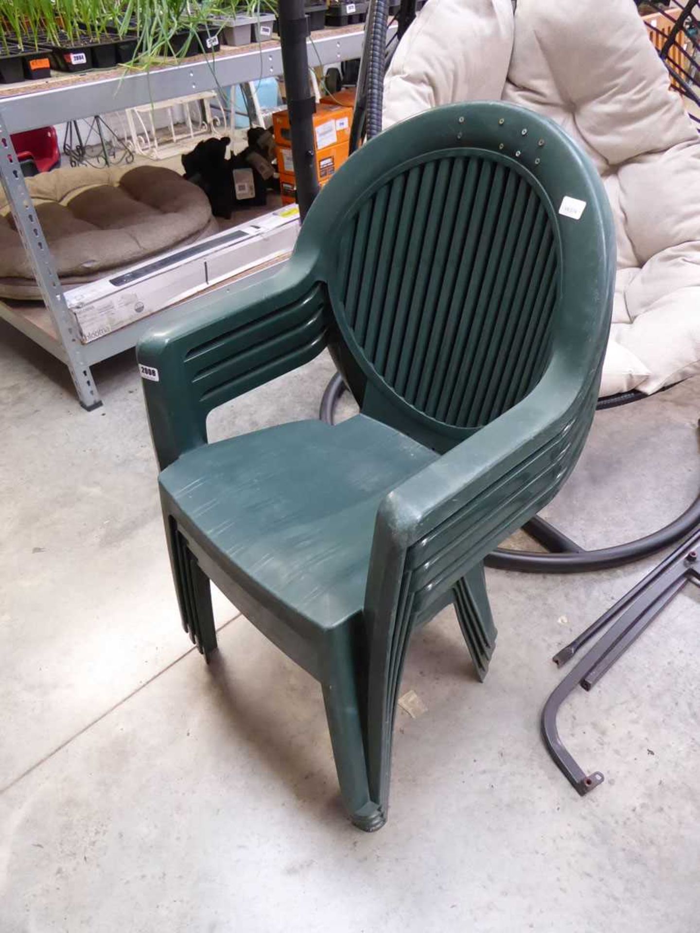 Set of 4 green plastic garden chairs