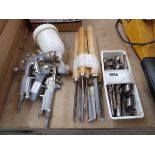 3 spray guns together with a quantity of carpenter's chisels and a Linbin of mixed size drill bits