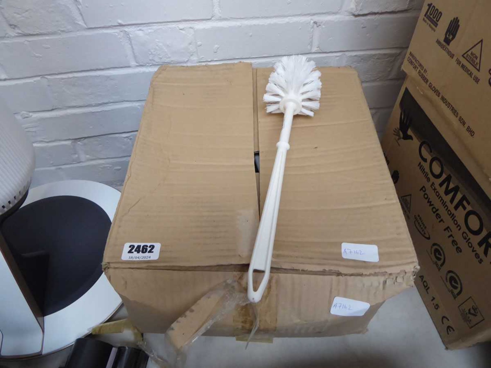 Box containing large qty of toilet brushes