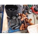 Pallet containing a large quantity of 4" drainage parts and accessories