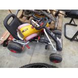 Childs 4 wheeled pedal go kart together with a childs plastic ride on car