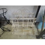 Pair of weathered wrought iron wall mounted outdoor shelves