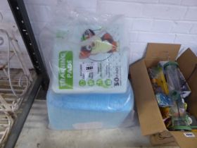 Bag of puppy training mats and pads