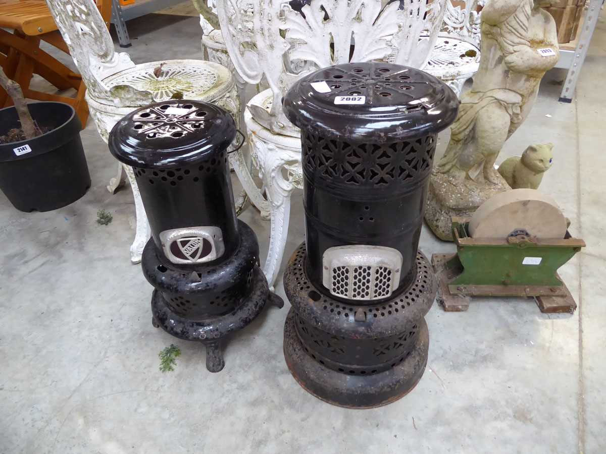 Near pair of vintage metal heaters