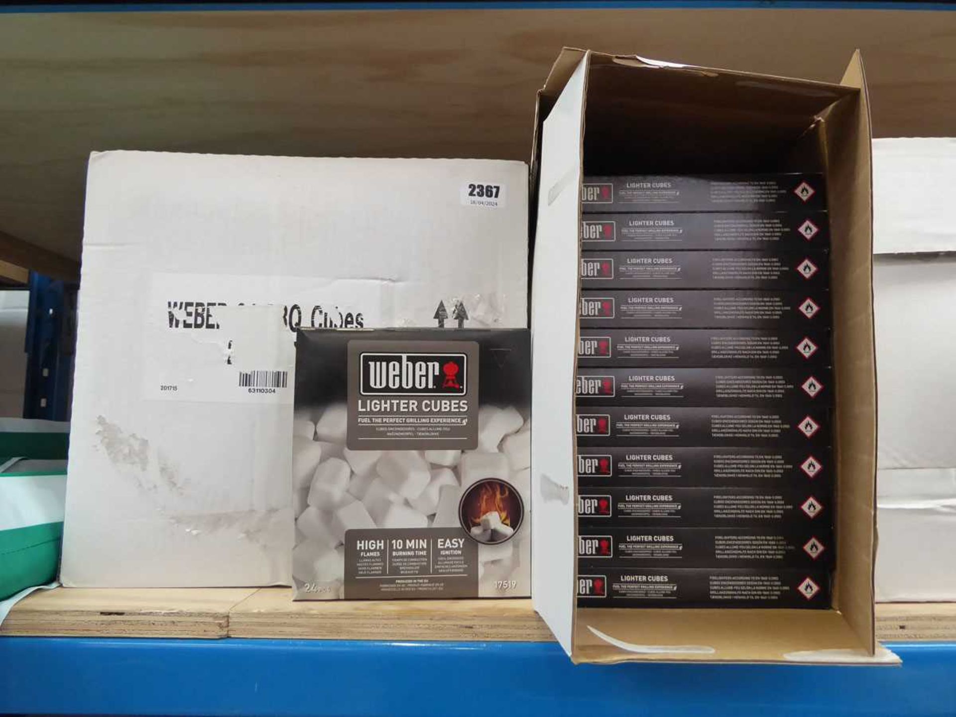 2 boxes containing 24 packs of Weber fire lighter cube sets