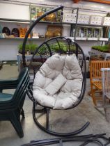 Black rattan single seater garden hanging egg chair with beige cushion