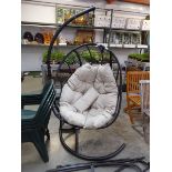 Black rattan single seater garden hanging egg chair with beige cushion