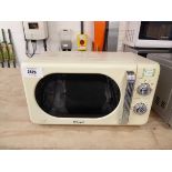 +VAT Boxed DeLonghi microwave oven in cream