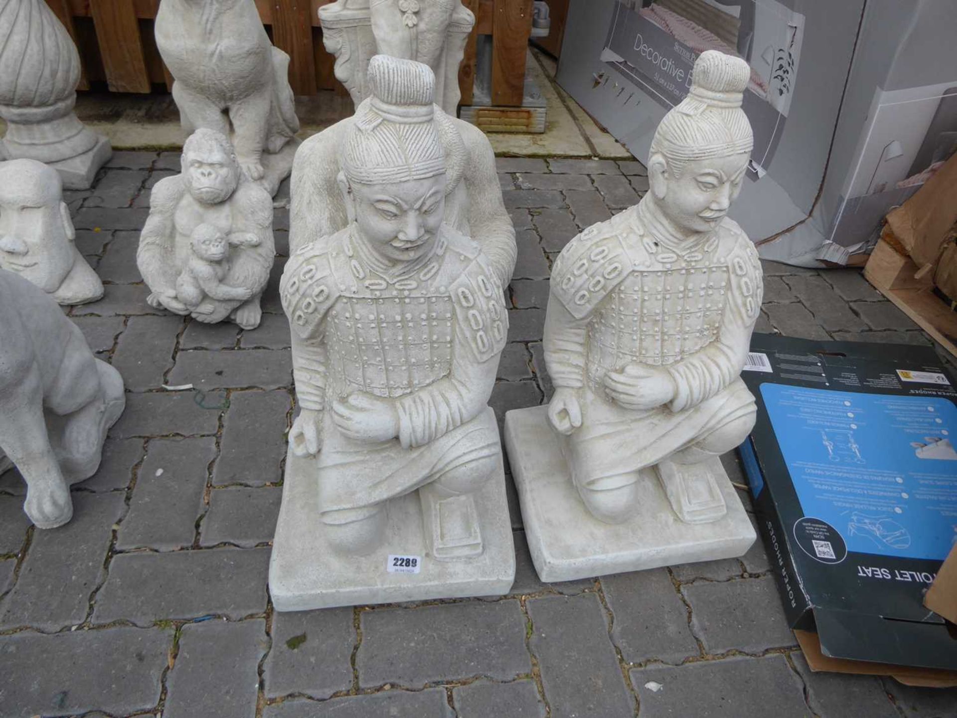 Pair of concrete kneeling Chinese warriors