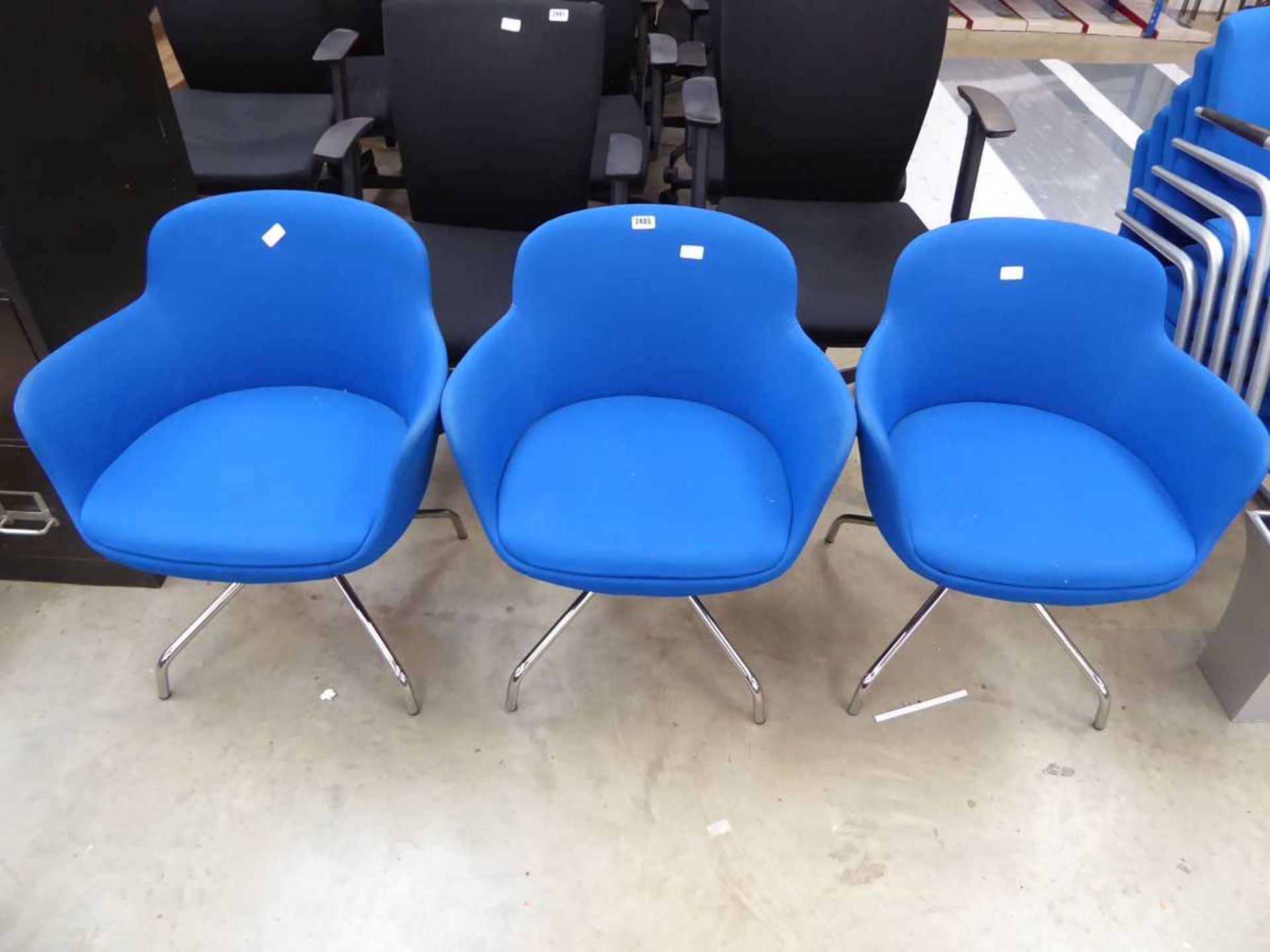 Set of 3 blue fabric conference chairs on metal support