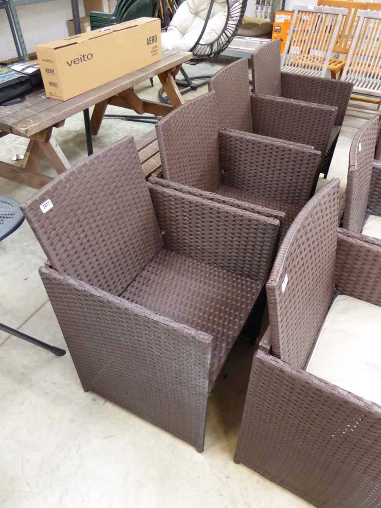 Set of 4 brown rattan garden chairs each with matching beige - no cushions