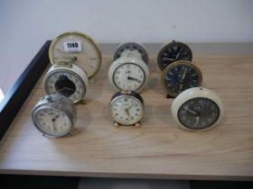 Collection of 9 various small clocks