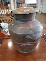 Large metal urn with lid