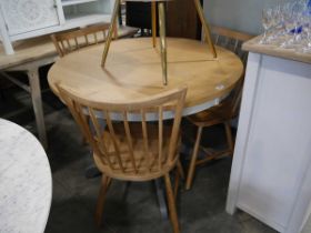 Single pedestal circular dining table with oak effect surface, together with 3 wooden stick back