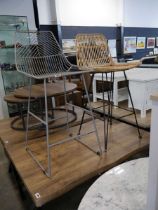 2 similar bar height stools in wire work finish