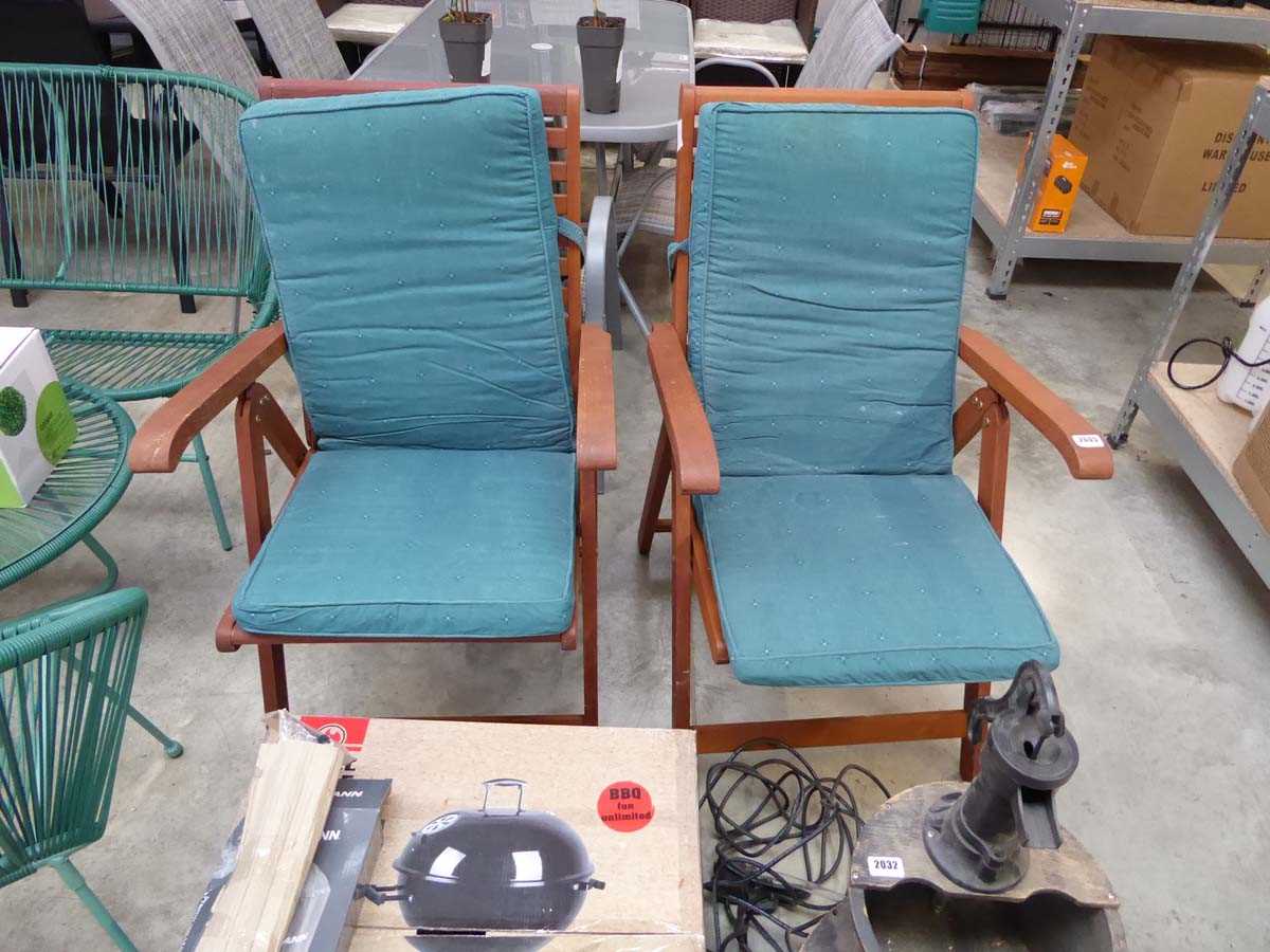 Pair of teak garden armchairs with matching green cushions