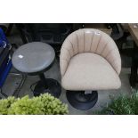 Beige and black shell shaped height adjustable bar stool together with circular grey and black