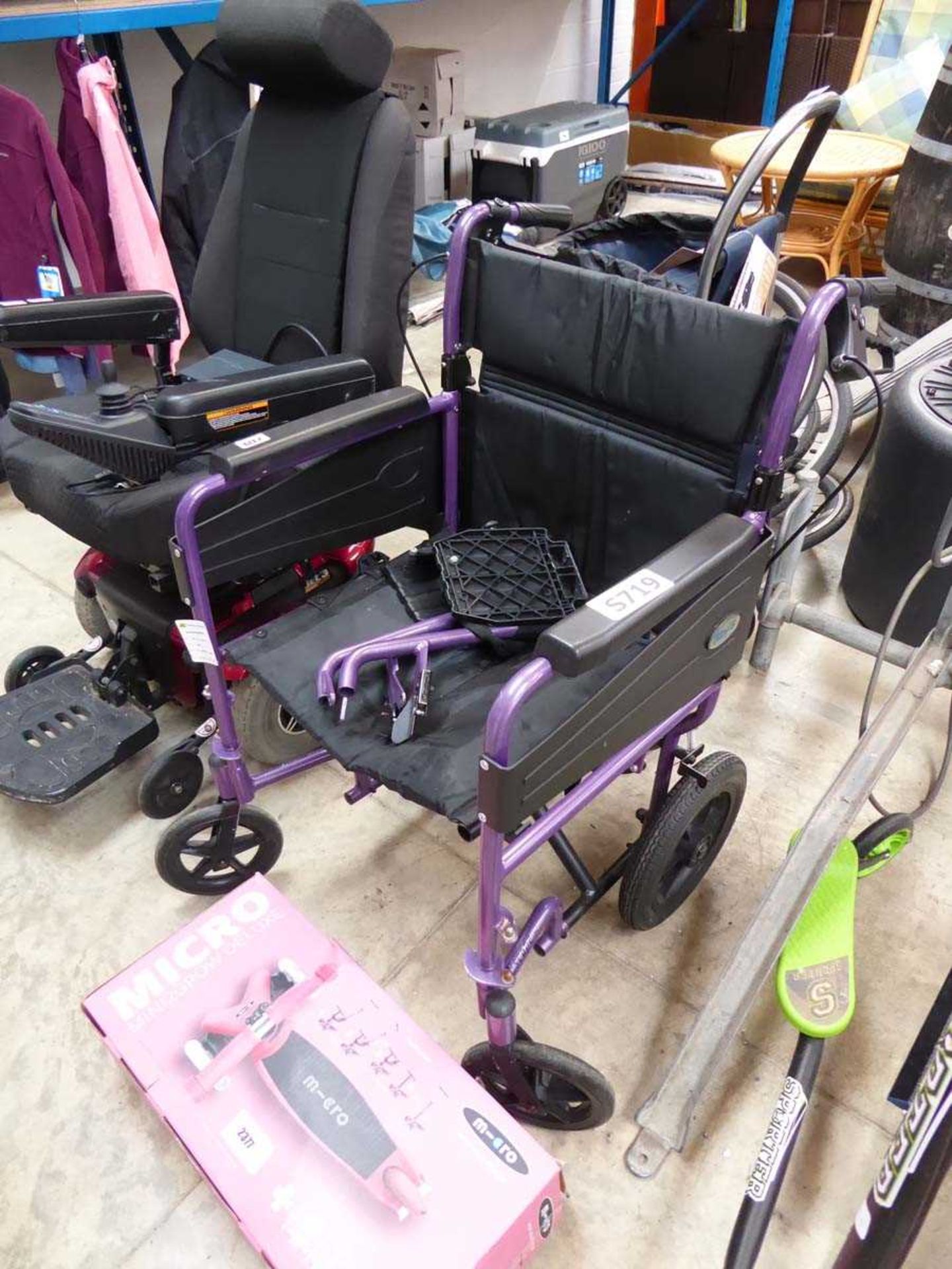 Black and purple collapsible 4 wheeled wheelchair