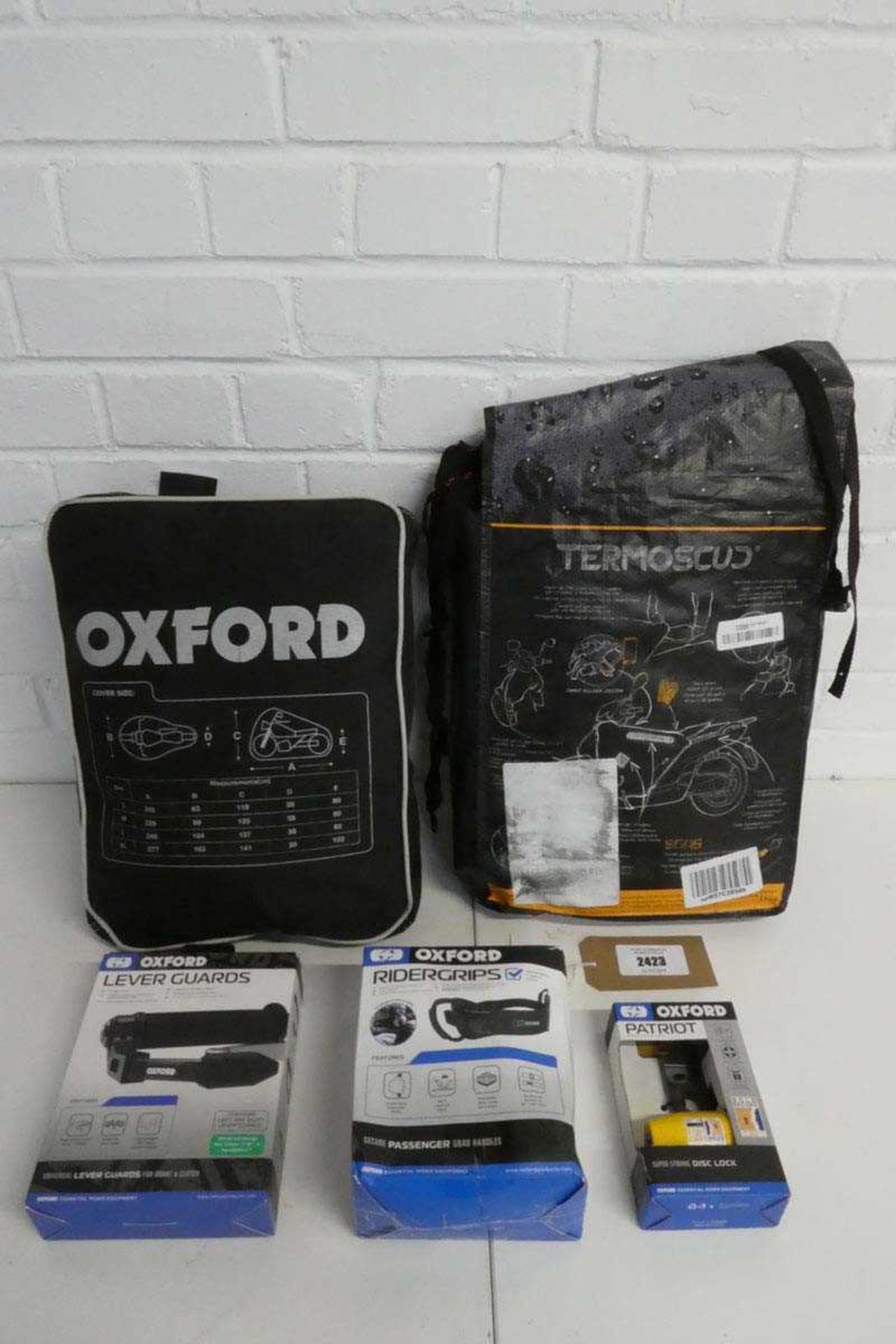 +VAT 5 pieces of mainly motorcycle accessories to include an Oxford motorcycle cover (size