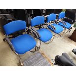 Set of 4blue clothed conference stacking chairs on chrome tubular legs