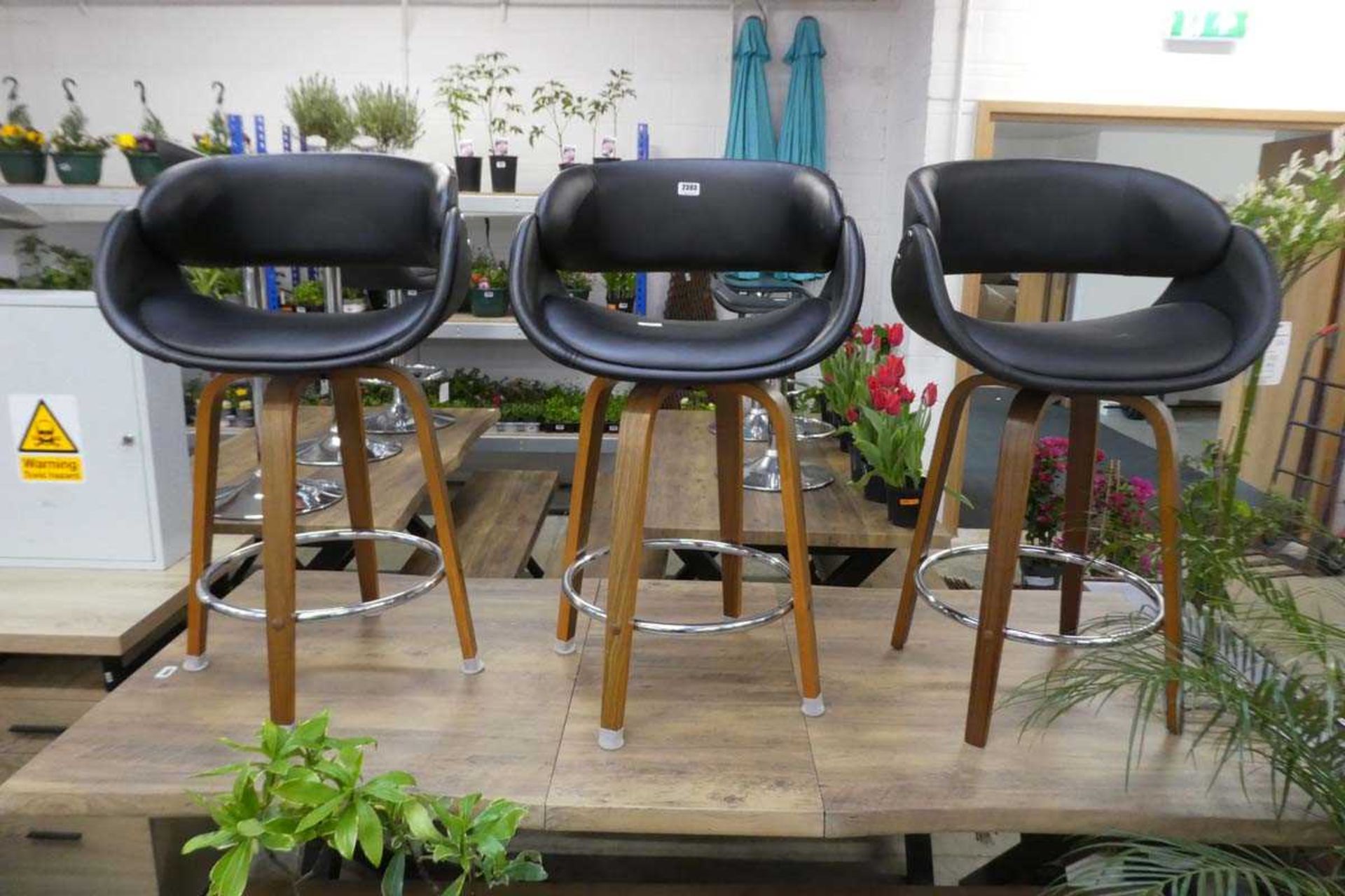 Set of 3 black leatherette high topped stools on wooden legs