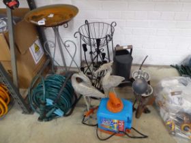 An assortment of decorative garden items to include weathered metal bird bath, pair of metal free