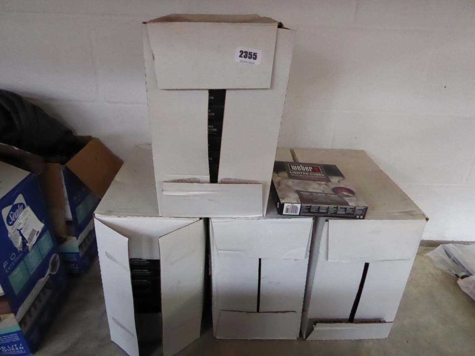4 boxes containing 24 packs of Weber fire lighter cube sets
