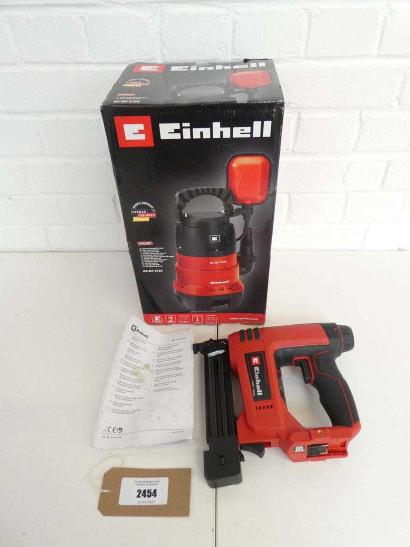 +VAT Boxed Einhell dirty water pump together with an Einhell 18v cordless nailer