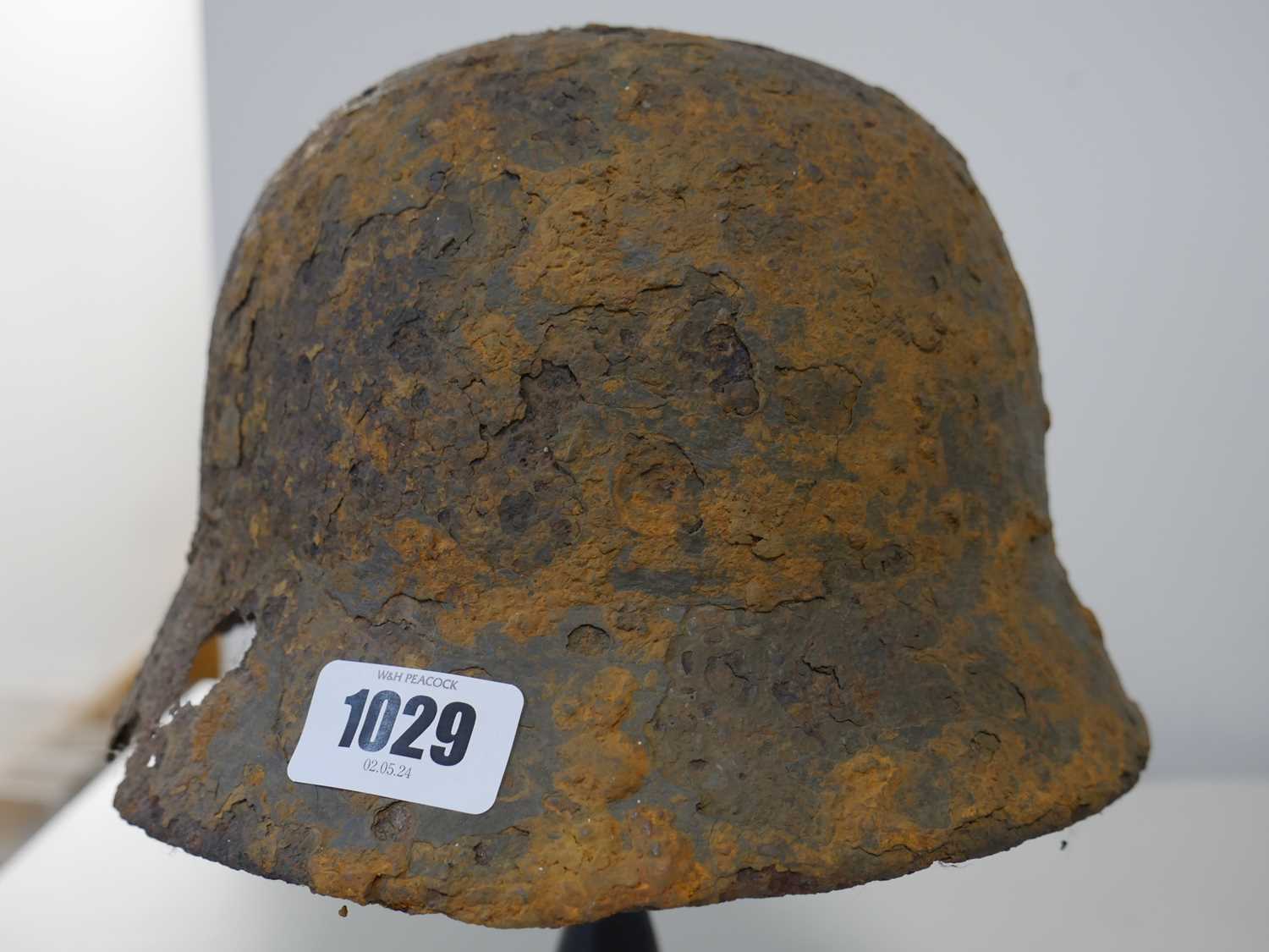Military helmet bearing Nazi insignia on purpose built wooden stand Heavy rusting and deterioration - Image 4 of 6