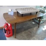 Modern dining table in wood finish on tapered supports