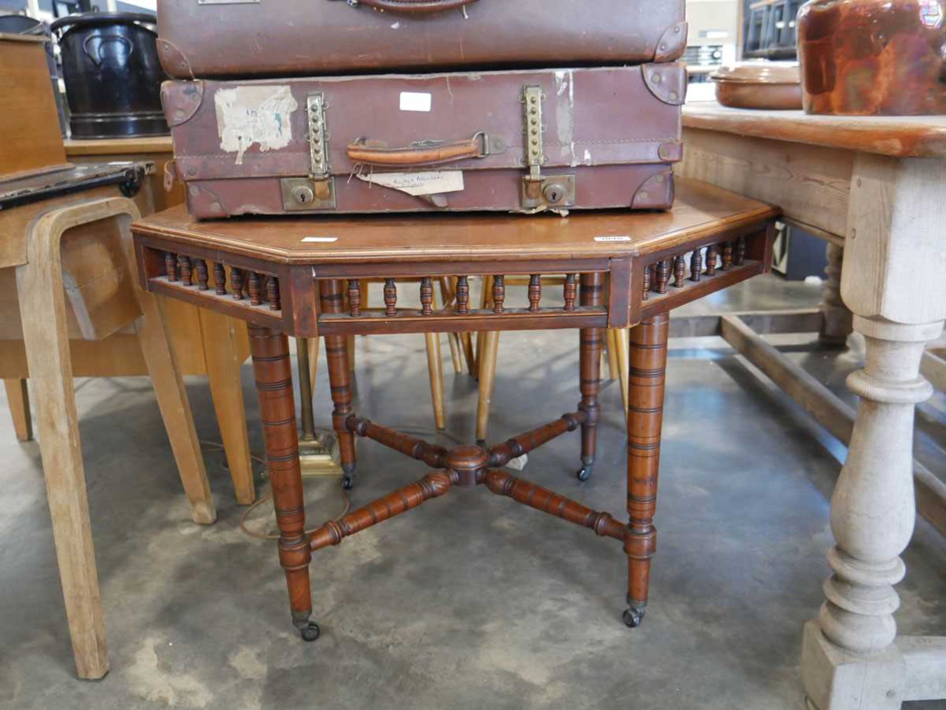 Octagonal mahogany centre table on castors - Image 2 of 3