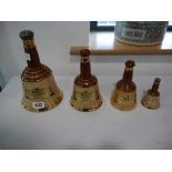 Graduated set of Wade Bells whisky empty decanters