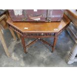 Octagonal mahogany centre table on castors