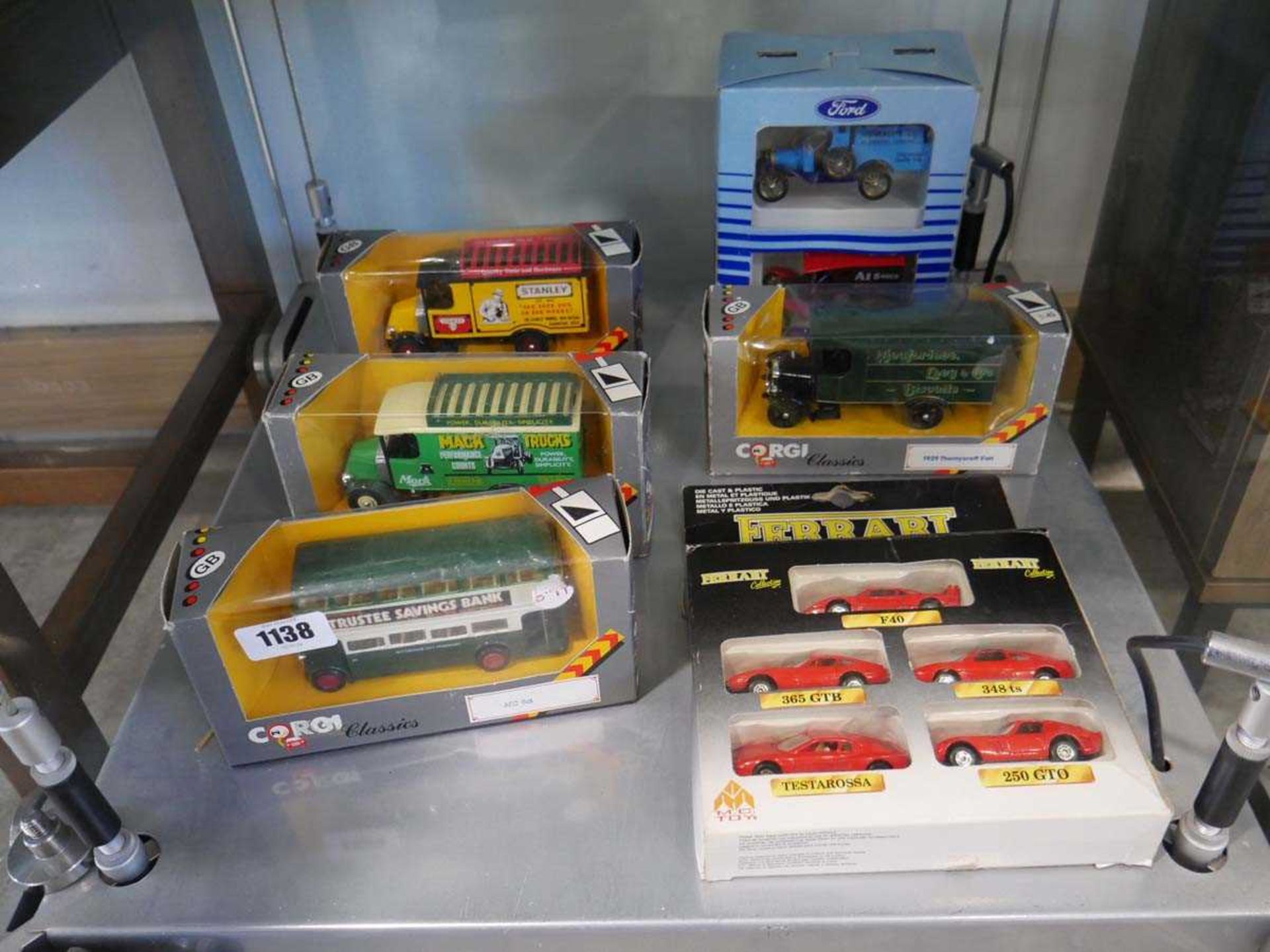 Shelf of boxed die cast vehicles incl. Ferrari Collection, various tradesmans vehicles and Trustee