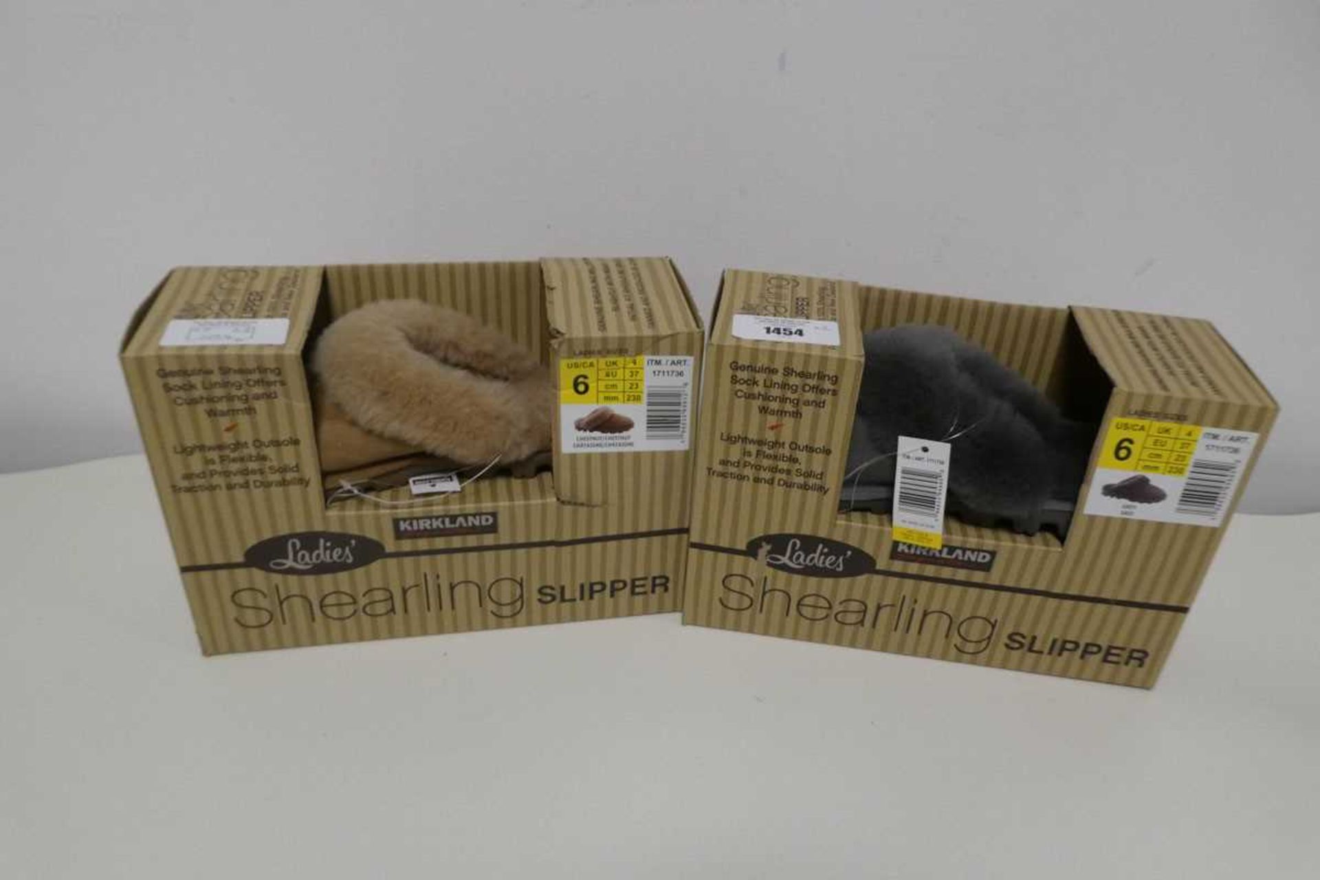 +VAT 2 boxed pairs of womens Kirkland shearling slippers. Both size 4.