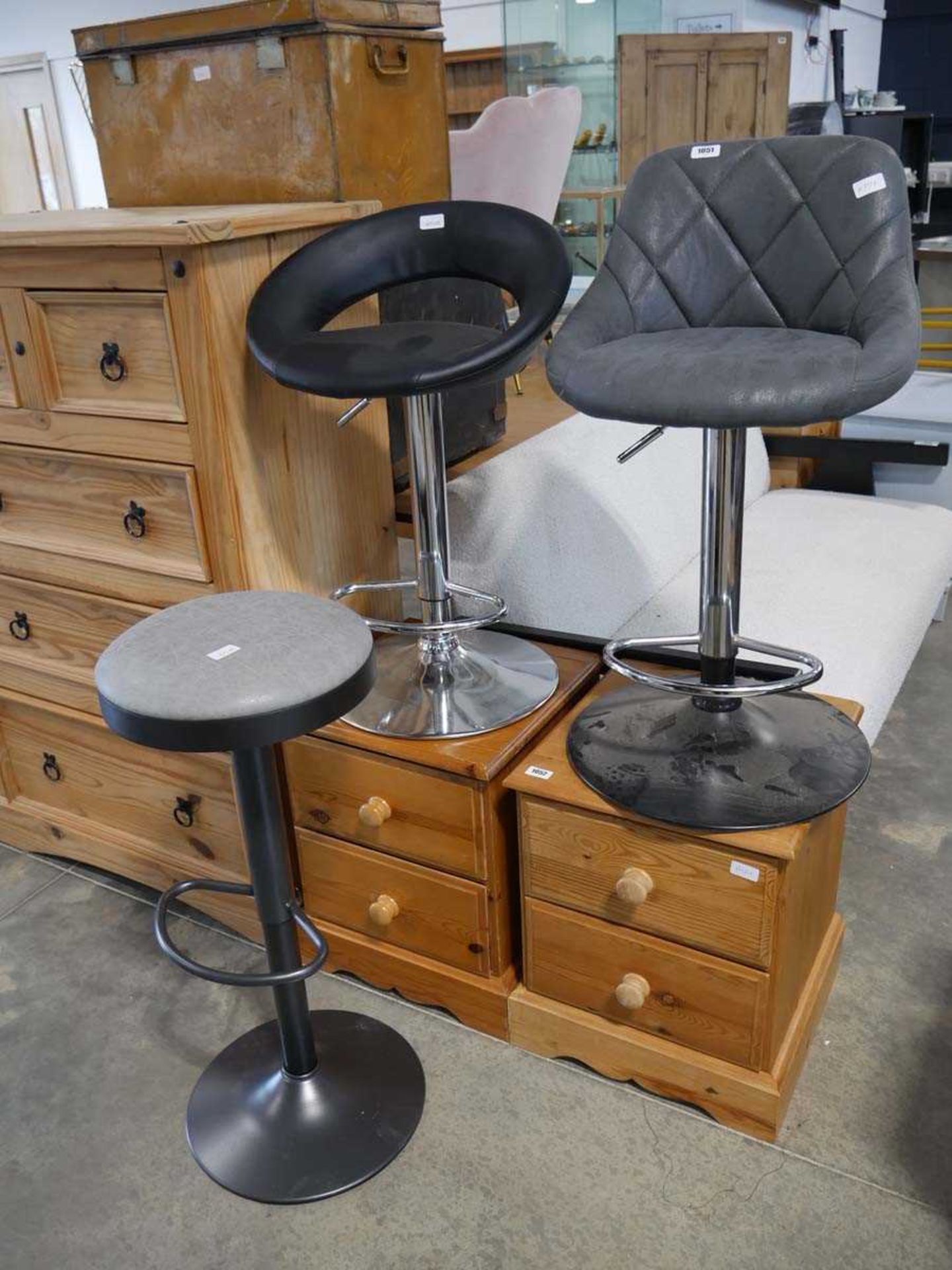 Concrete coloured suede upholstered bar stool on black metal base