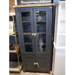 Blue/ grey glass fronted pantry cupboard with further cupboard storage below and light oak top