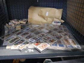 Cage containing various cigarette cards and tea cards