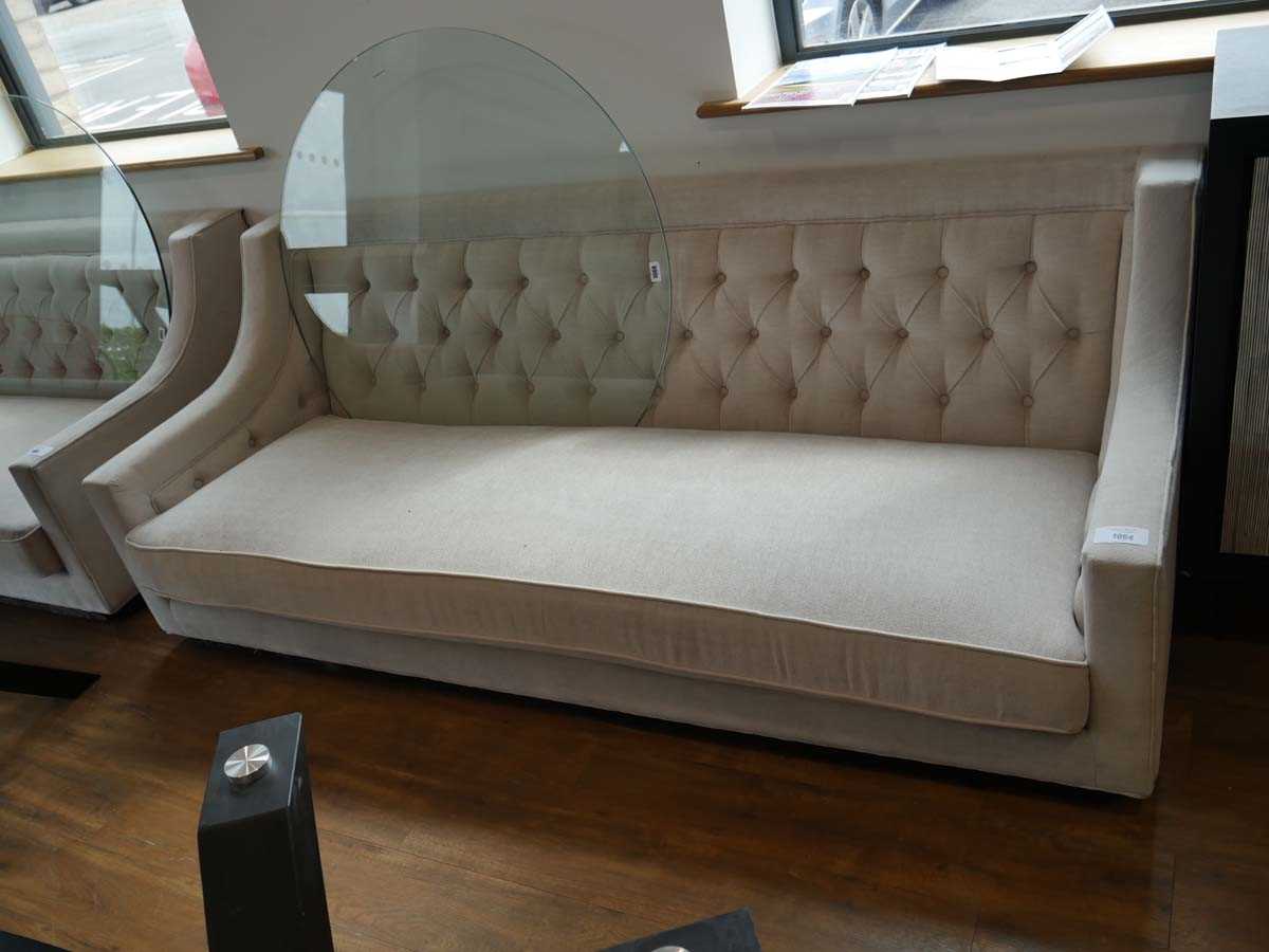 +VAT Low level beige upholstered button back sofa on black plinth type base