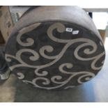 Cylindrical footstool with swirly pattern