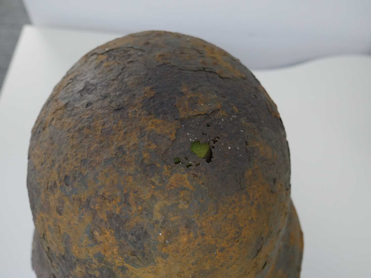 Military helmet bearing Nazi insignia on purpose built wooden stand Heavy rusting and deterioration - Image 2 of 6