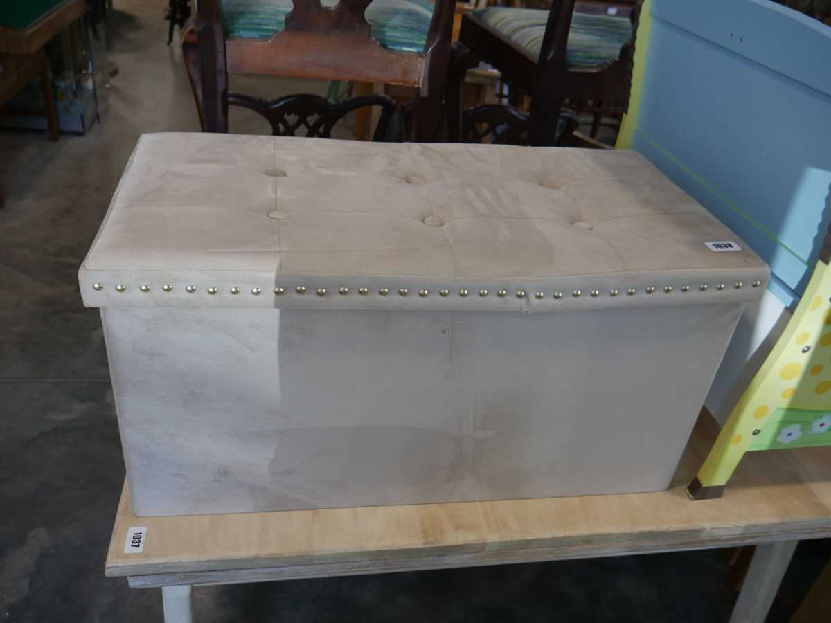 Beige upholstered ottoman