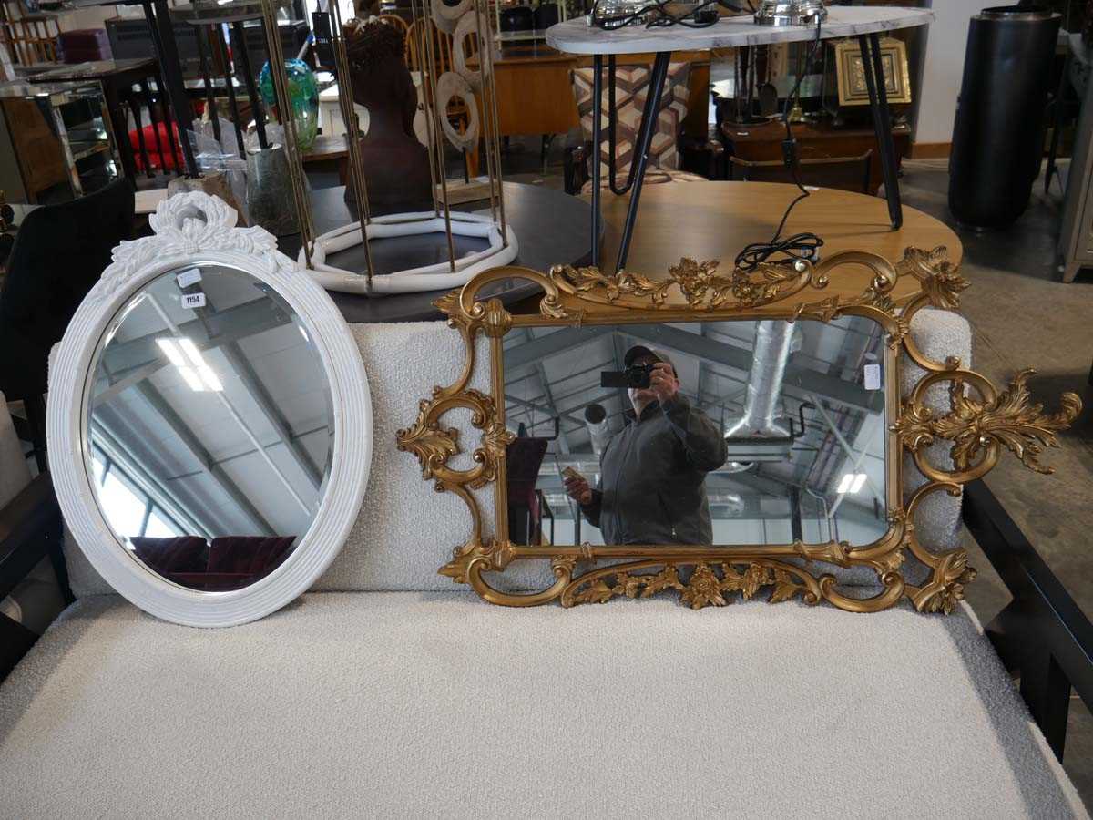 Ornate gilt framed rectangular wall mirror and ornate white framed oval wall mirror