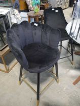 3 black suede upholstered bar height stools of varying design