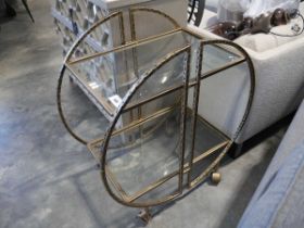 +VAT Brass finished 2 tier glass topped serving trolley on castors in a deco style design