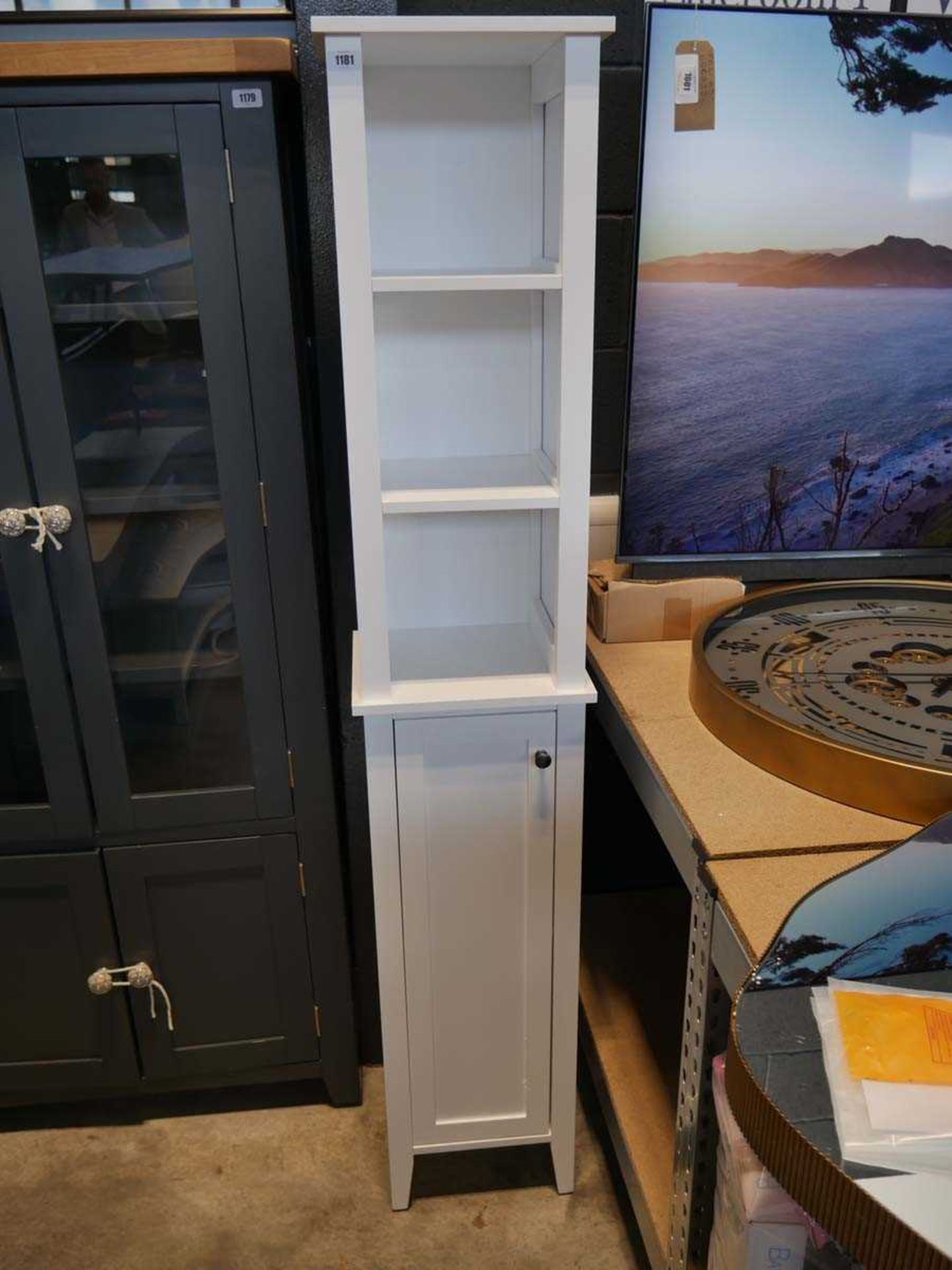Modern white single door bathroom cupboard with open fronted shelving above