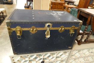 Dark blue twin handled storage trunk with brass banding and details