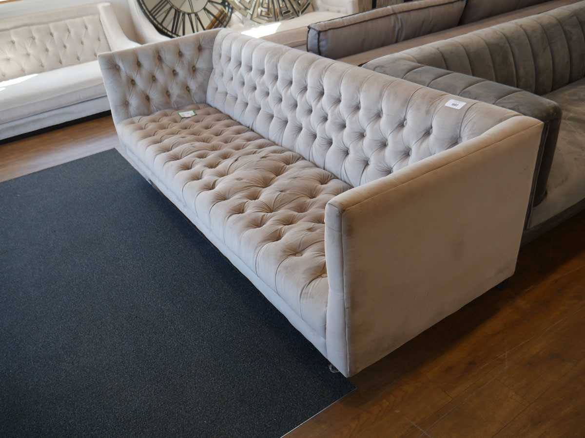 +VAT Modern light grey sofa on brushed chrome tapered supports upholstered in button back finish