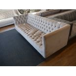 +VAT Modern light grey sofa on brushed chrome tapered supports upholstered in button back finish