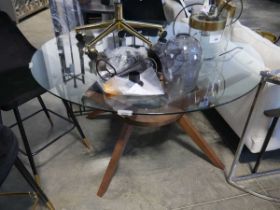 Circular glass top dining table on hardwood finish base